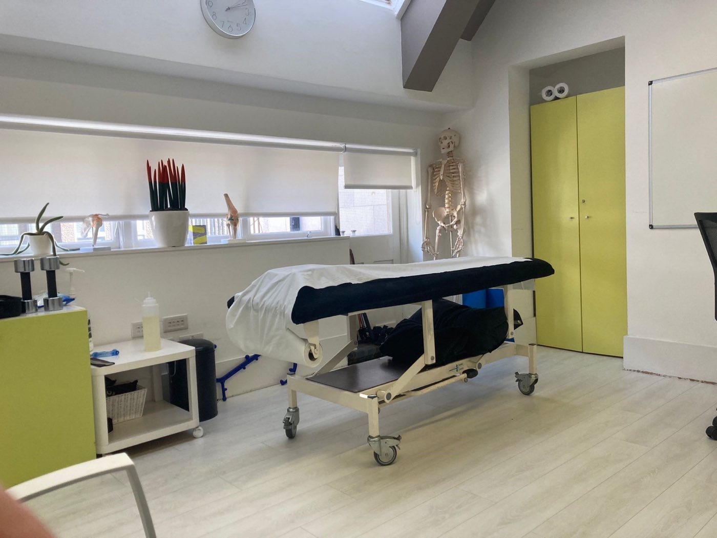 The physiotherapy treatment room, with a treatment couch and rehabilitation equipment